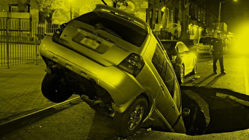 A parked car fallen in a sink hole. Photo: Christopher Sadowski, 2020.