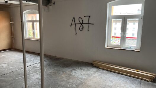 Graffiti on the wall of a space allocated to the Question of Funding collective, documenta fifteen, 2022. Referencing the California Penal Code, “187” is slang for murder.