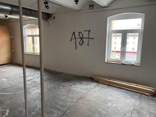 Graffiti on the wall of a space allocated to the Question of Funding collective, documenta fifteen, 2022. Referencing the California Penal Code, “187” is slang for murder.