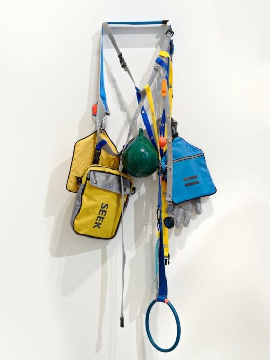 Lucy + Jorge Orta, Anticipation Accessory, 2010. Webbing, clips, kits, various objects, silkscreen print. Courtesy of Lucy + Jorge Orta. Photo: Frances Ware.