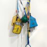 Lucy + Jorge Orta, Anticipation Accessory, 2010. Webbing, clips, kits, various objects, silkscreen print. Courtesy of Lucy + Jorge Orta. Photo: Frances Ware.