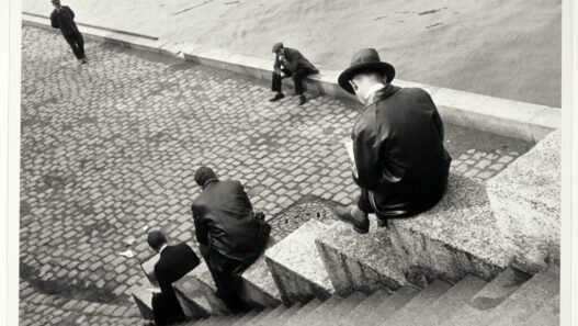 Ilse Bing, Three Men Sitting on the Steps by the Seine, 1931. International Center of Photography, New York, donation of Ilse Bing, 1991. © Estate of Ilse Bing.