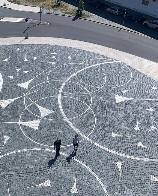 Katja Davar, Globe of Glass, 2022. Lasa marble, basalt, total area 850 m2. Courtesy of the artist and Fraunhofer IEE. © Katja Davar. Photo: zone4, Cologne.