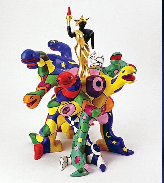 Works by Niki de Saint Phalle. Left: La mort n’existe pas, 2001. Silkscreen print, 62 x 48 cm. MAMAC collection, Nice. © Dimitri Angelini. Center: Tree of Liberty(Queen Califia), 2001. Polyester paint, gold leaf, 48 x 50 x 54 cm. © 2022 Niki Charitable Art Foundation /Adagp, Paris. Right: Flacon de parfum, 1982. Glass and plastic, 35 x 12 x 12cm. Collection Dumetz-Grenouilleau. © 2022 Niki Charitable Art Foundation / Adagp, Paris.