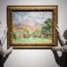 Art handlers hold a painting titled “La montagne Sainte-Victoire” by Paul Cezanne (estimate on request: in excess of $120,000,000) during a photo call to present the highlights from the estate of the philanthropist and co-founder of Microsoft, Paul G. Allen in London on Oct. 14, 2022.