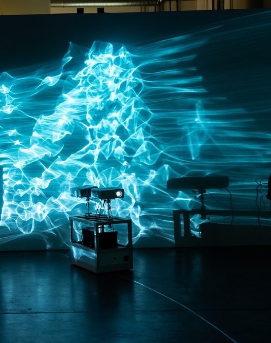 Bull.Miletic, Zoom Blue Dot, 1990–2020. Two-channel kinetic video installation, Mylar curtain, Mylar tape, custom robotics. Installation view, Museum of Craft and Design, 2022. Courtesy of Dallis Willard.