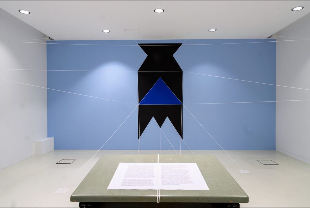 Patrick Ireland (aka Brian O’Doherty), HCE Redux, 2004 (remade 2019). Paint, cord, table, chair, typed paper. Dimensions variable. Installation view at the Van Abbemuseum, Eindhoven, The Netherlands, 2019–20. Photo: Van Abbemuseum. Courtesy of The Estate of Brian O'Doherty. Sirius Arts Centre.