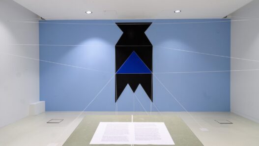 Patrick Ireland (aka Brian O’Doherty), HCE Redux, 2004 (remade 2019). Paint, cord, table, chair, typed paper. Dimensions variable. Installation view at the Van Abbemuseum, Eindhoven, The Netherlands, 2019–20. Photo: Van Abbemuseum. Courtesy of The Estate of Brian O'Doherty. Sirius Arts Centre.