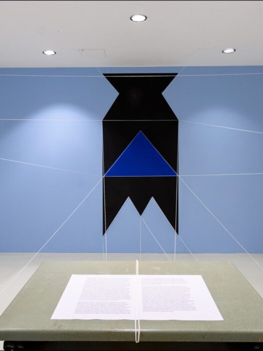 Patrick Ireland (aka Brian O’Doherty), HCE Redux, 2004 (remade 2019). Paint, cord, table, chair, typed paper. Dimensions variable. Installation view at the Van Abbemuseum, Eindhoven, The Netherlands, 2019–20. Photo: Van Abbemuseum. Courtesy of The Estate of Brian O'Doherty. Sirius Arts Centre.